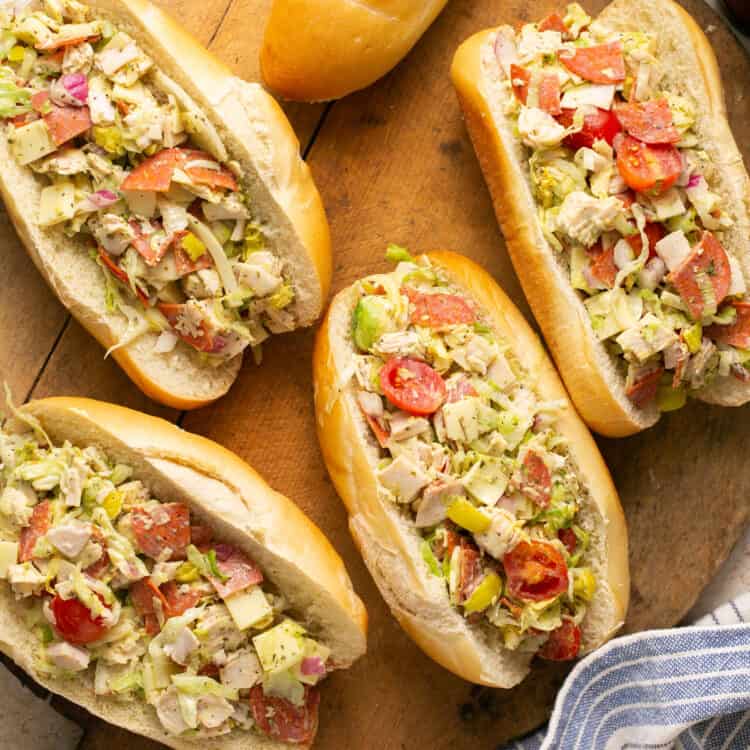 Chopped italian grinder salad recipe served on hoagies on a tray.