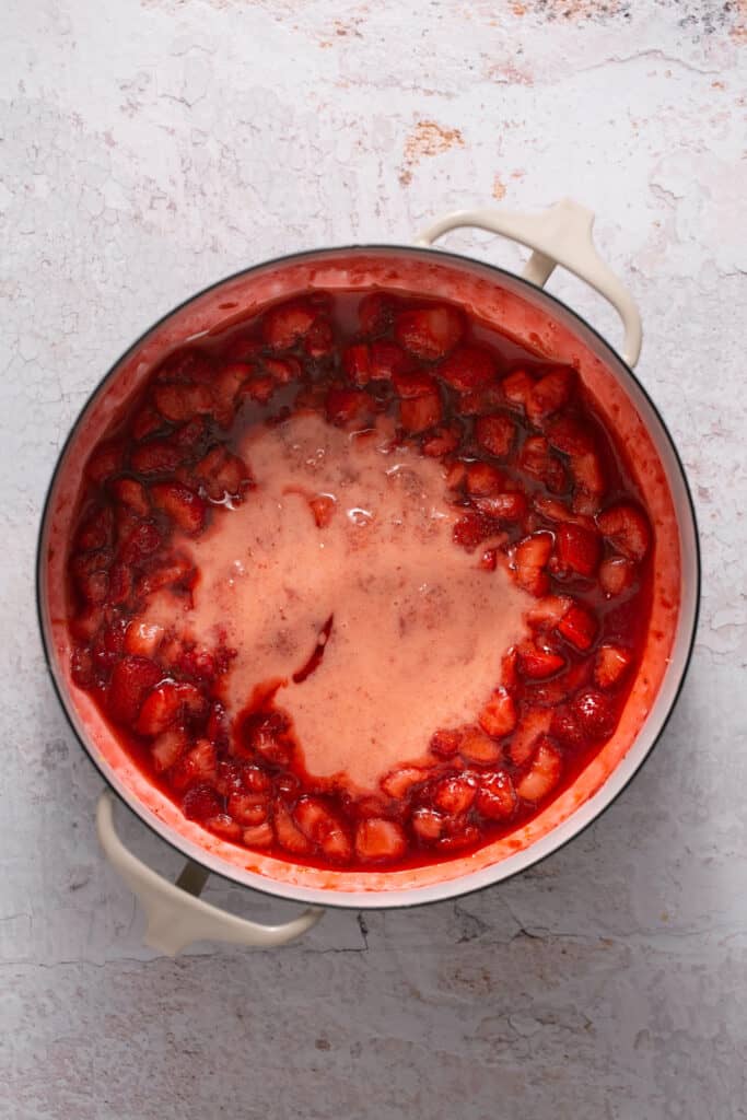 Strawberry mixture in a saucepan.