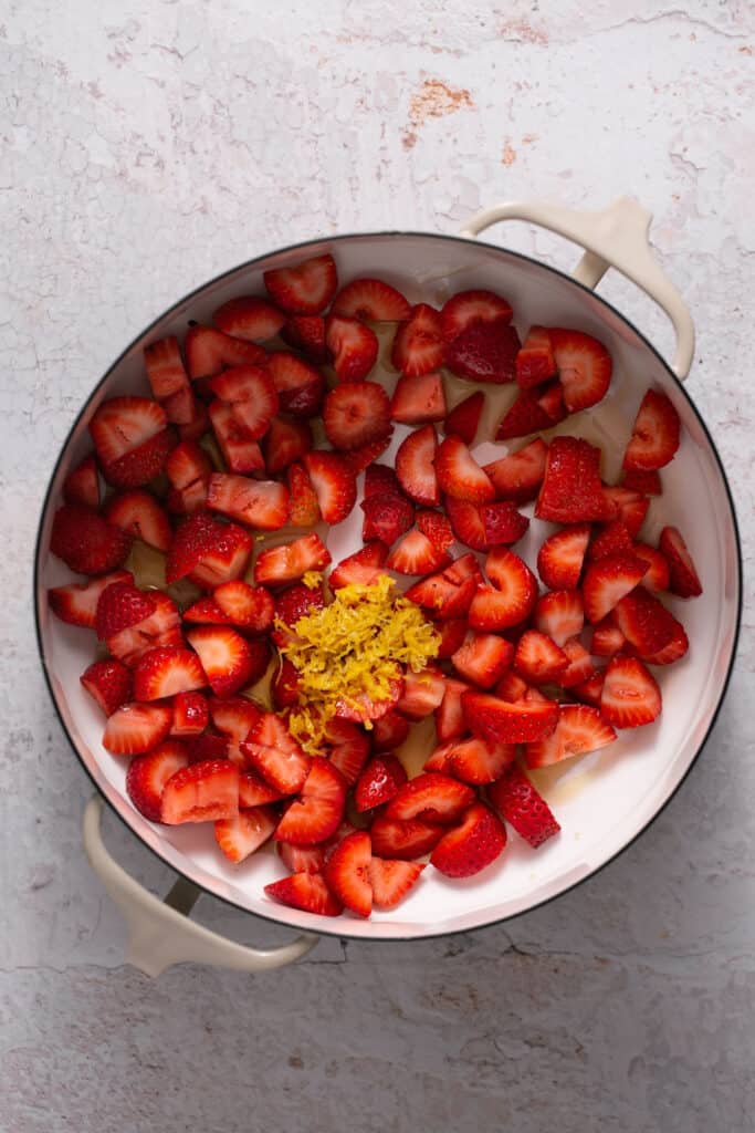 Strawberries in a saucepan before being cooked.