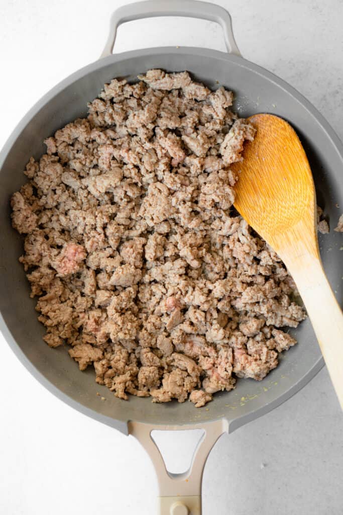 Cooked ground turkey in a skillet.