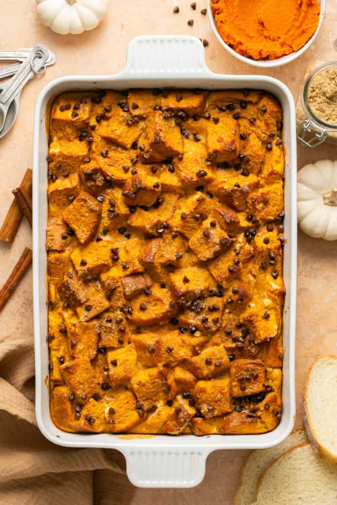 Pumpkin chocolate chip protein french toast bake in a baking dish after being baked.