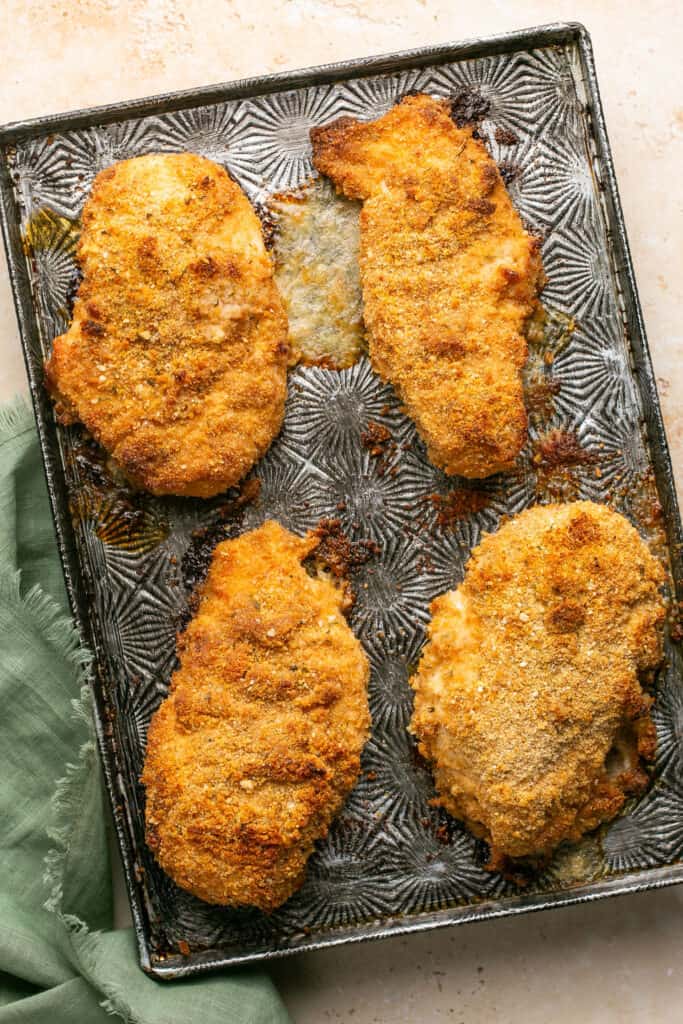 Crispy Meal Prep Breaded Chicken on a baking sheet after being baked.