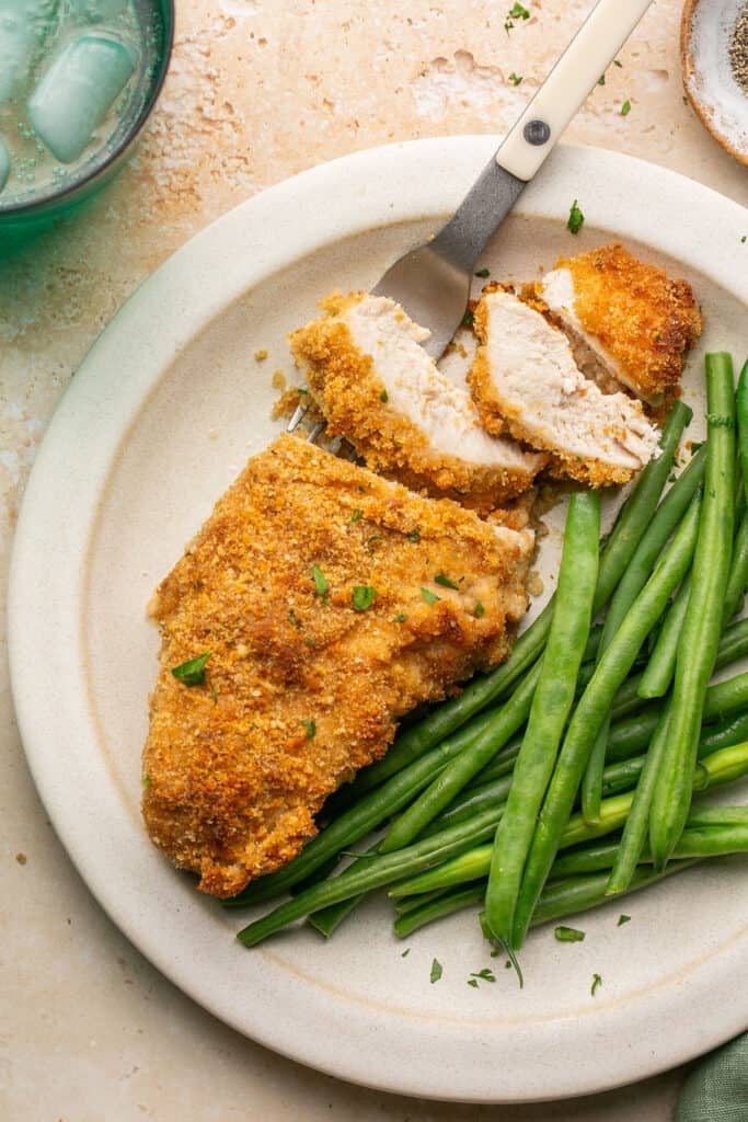 Meal Prep Breaded Chicken (No Egg) on a plate with green beans.