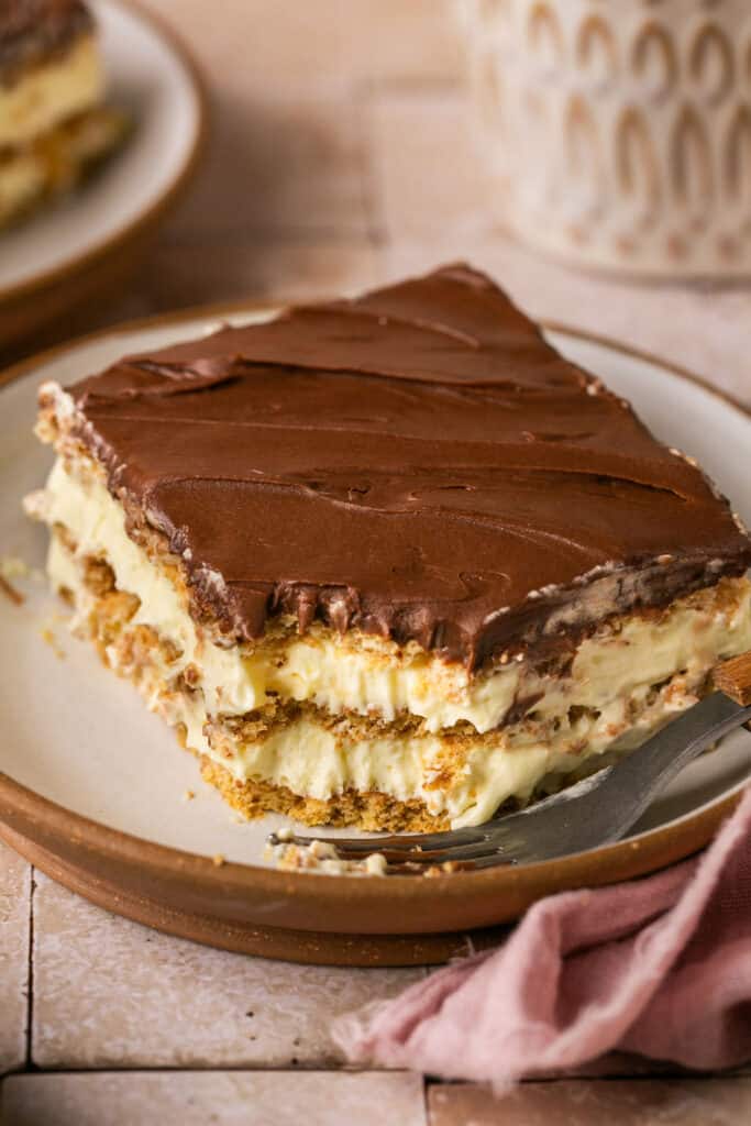 Lightened up chocolate eclair cake on small plate.
