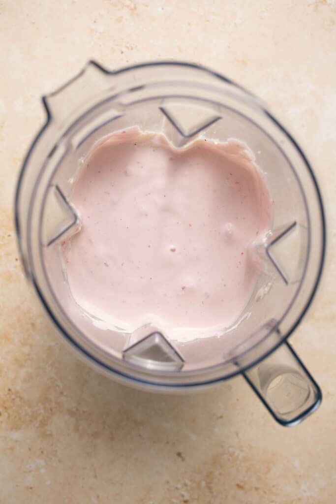 strawberry cheesecake ninja creami protein ice cream after being blended in the Ninja Creami.