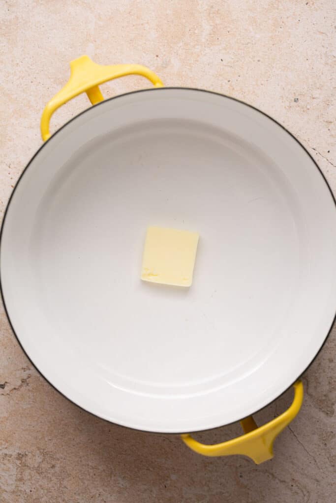 A small square of butter in a dutch oven.