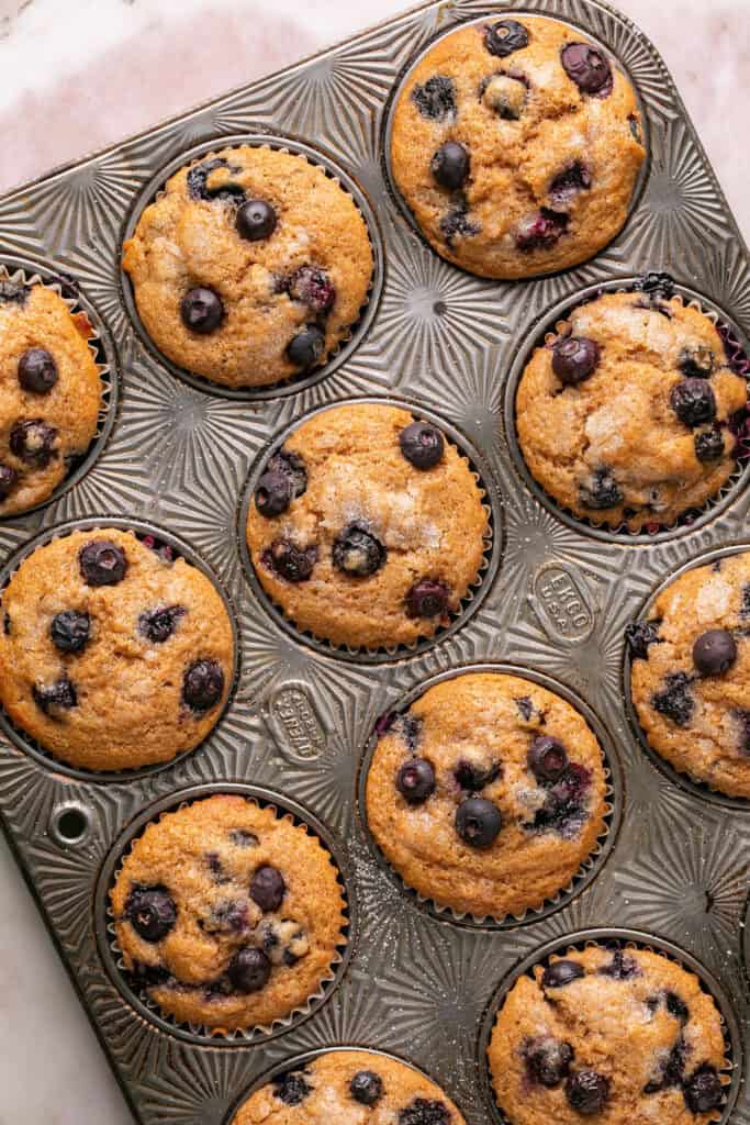 Greek yogurt muffins in a muffin pan.