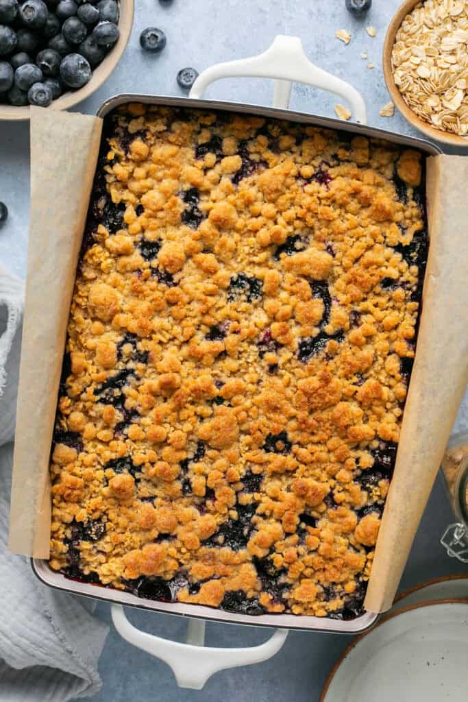 Blueberry muffin baked oatmeal in a baking pan after being baked.