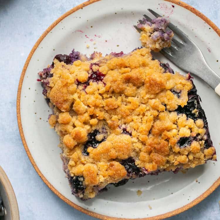 Blueberry muffin baked oatmeal on a small plate.