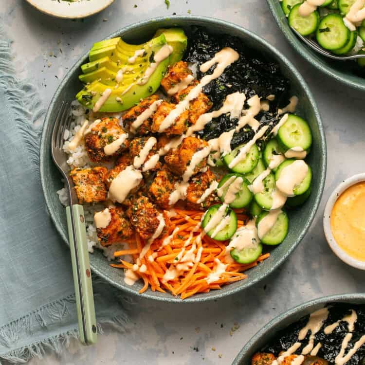 Air fryer salmon sushi bowl drizzled with spicy mayo.