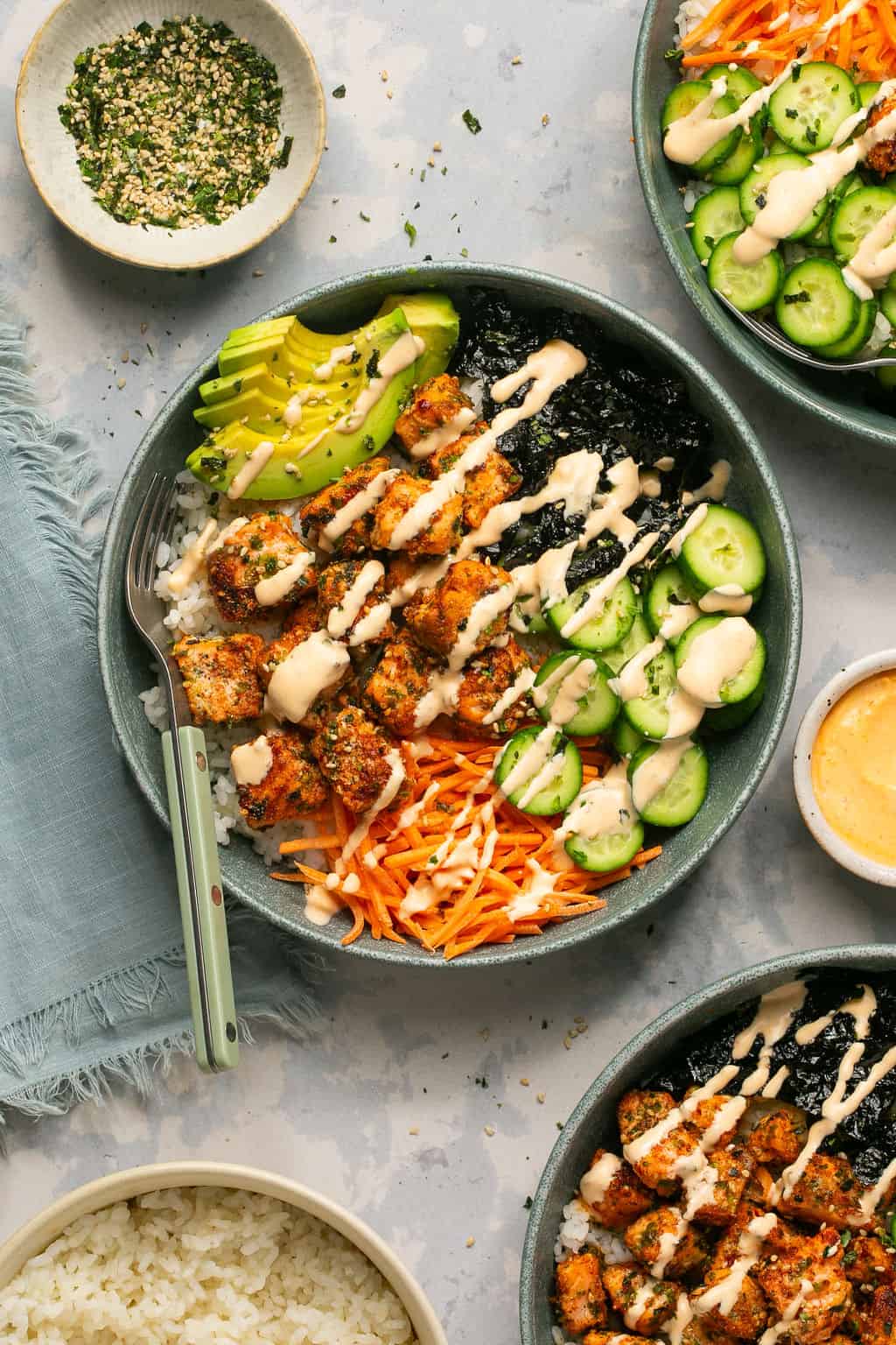 Air fryer salmon sushi bowl drizzled with spicy mayo.