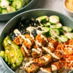 Air fryer salmon sushi bowl drizzled with spicy mayo.
