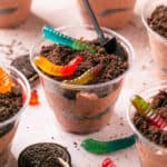 Oreo dirt cake cups topped with gummy worms.