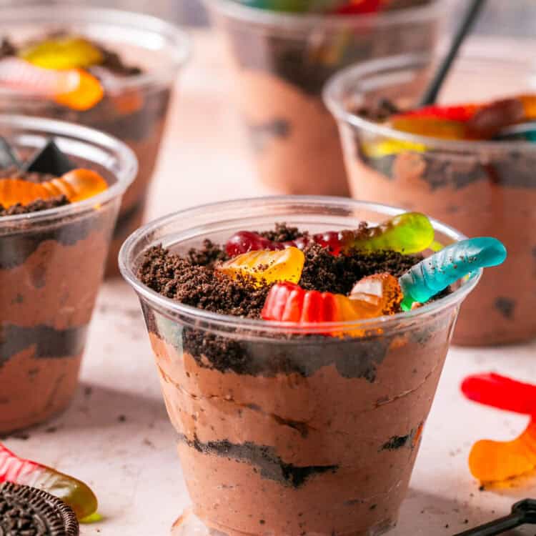 Oreo dirt cake cups topped with gummy worms.