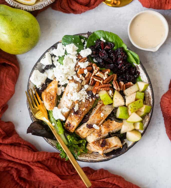 Honey Lemon Chicken & Pear Salad in a bowl with a fork.