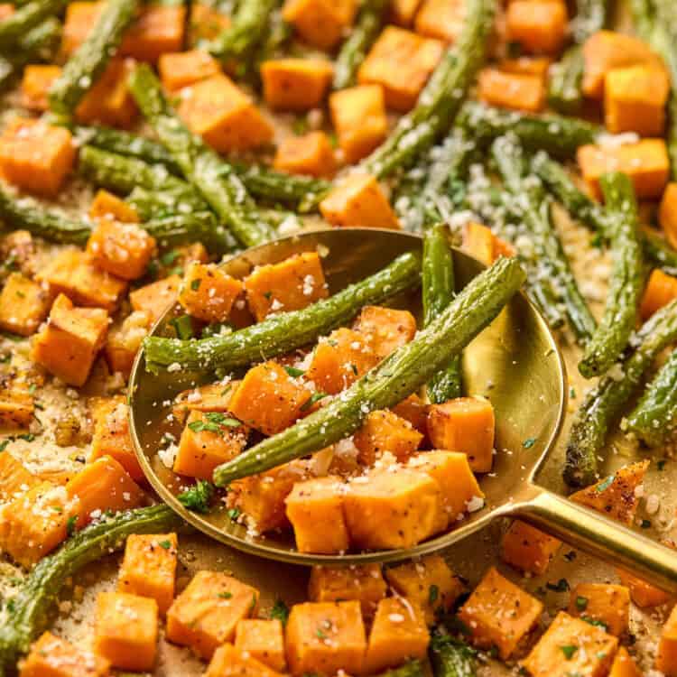 Roasted Sweet Potatoes and Green Beans on a sheet pan.