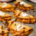 Crispy Chicken Tinga Tacos on a baking sheet.