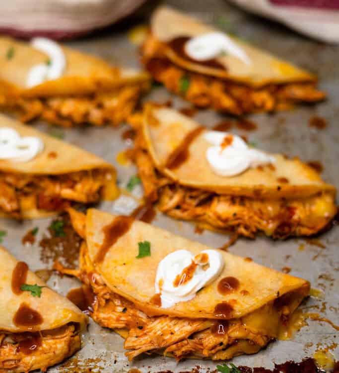 Crispy Chicken Tinga Tacos on a baking sheet.