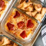 Zoomed in view of Pizza Dip Lunchables in a meal prep container.