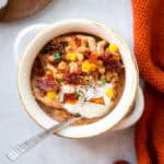 Marry Me Chicken Chili in a small bowl with a spoon.