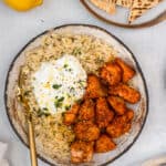 Salmon and Lemon Dill Rice on a plate with a fork.