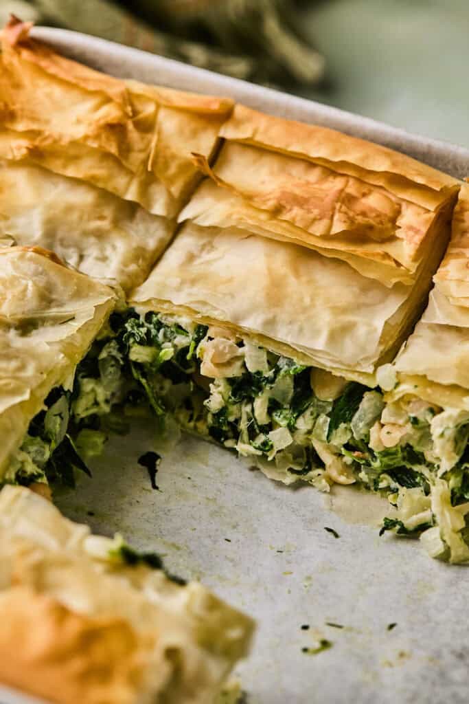 Spinach feta chicken pie in a baking dish.