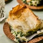 Spinach feta chicken pie on a plate.