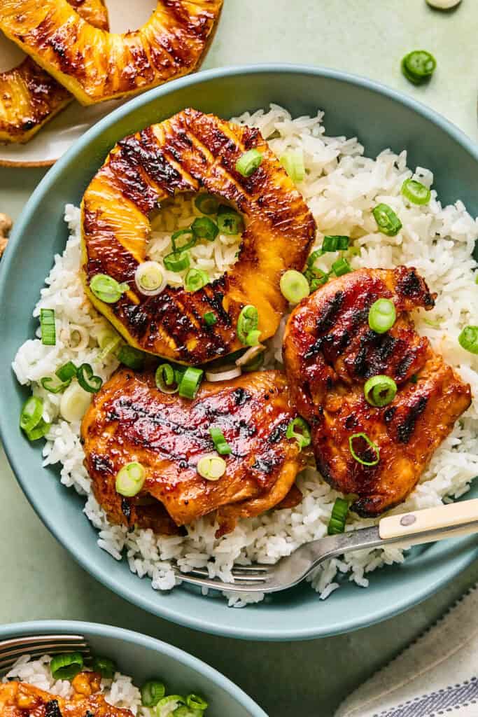 Pineapple Chicken Rice Bowls with forks.