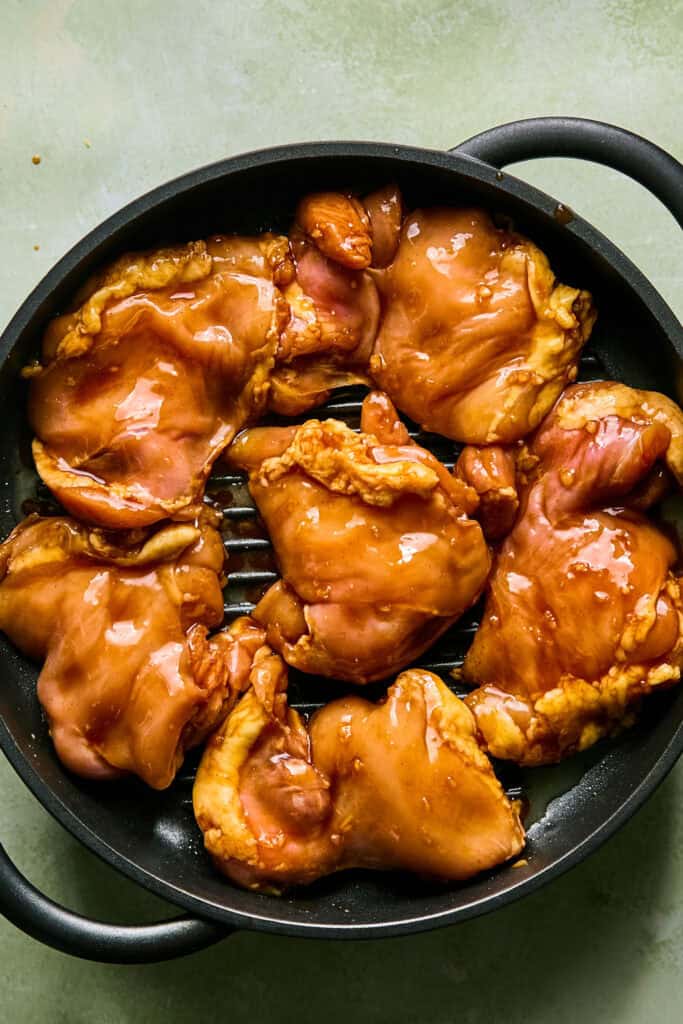 Huli Huli Chicken cooking on a grill pan.