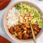 Blackened Salmon Caesar Bowl with a fork.
