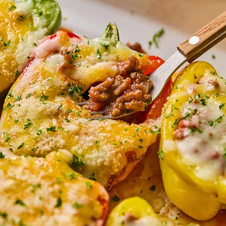 Bolognese Stuffed Peppers on a plate with a fork.