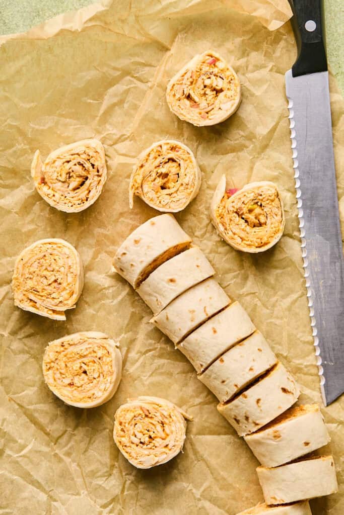Buffalo Chicken Pinwheels on parchment paper.