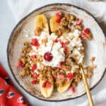 Cottage Cheese Banana Split in a bowl with a spoon.