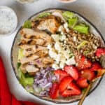 Strawberry Grilled Chicken Salad in a bowl with a fork.