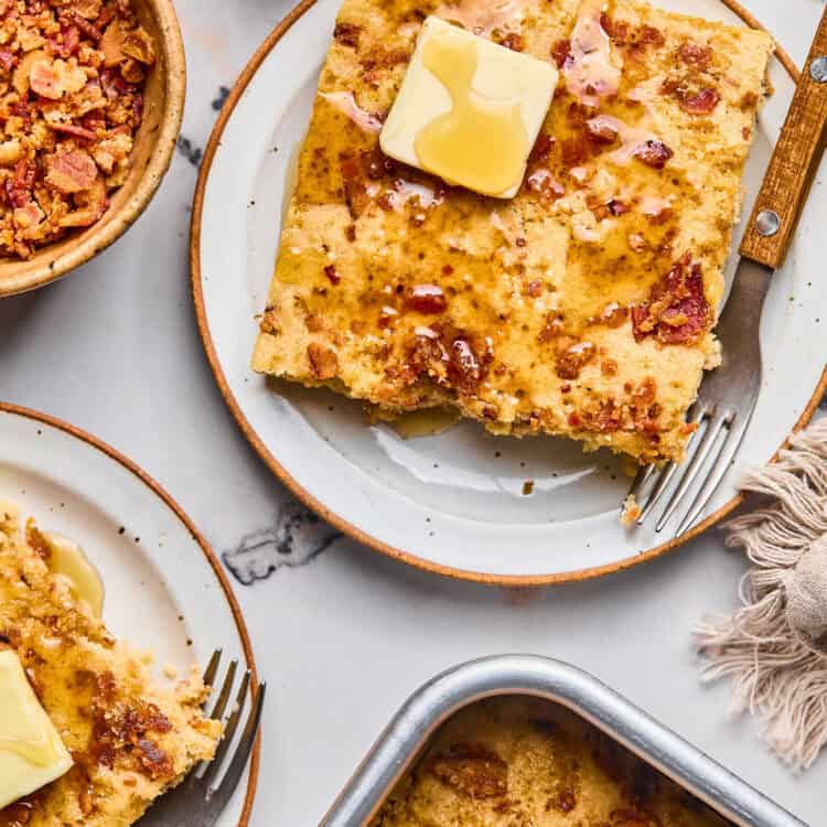 Maple Bacon Pancake Bake on a plate topped with butter and syrup.