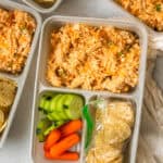 Buffalo Chicken Dip Lunchables with tortilla chips and veggies in meal prep containers.