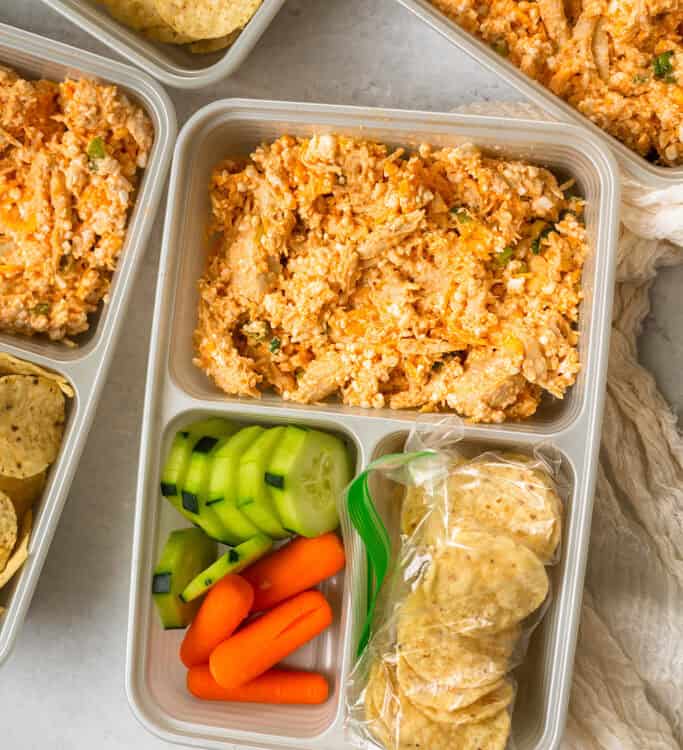 Buffalo Chicken Dip Lunchables with tortilla chips and veggies in meal prep containers.