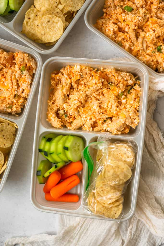 Buffalo Chicken Dip Lunchables with tortilla chips and veggies in meal prep containers.