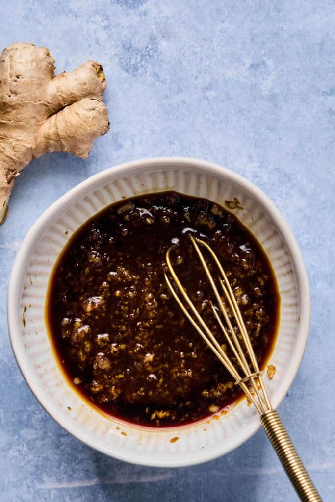 Hibachi Steak sauce in a small bowl with a whisk.
