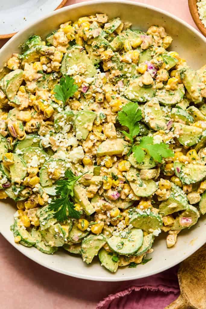 Zoomed in view of Mexican Cucumber Corn Salad in a large bowl.