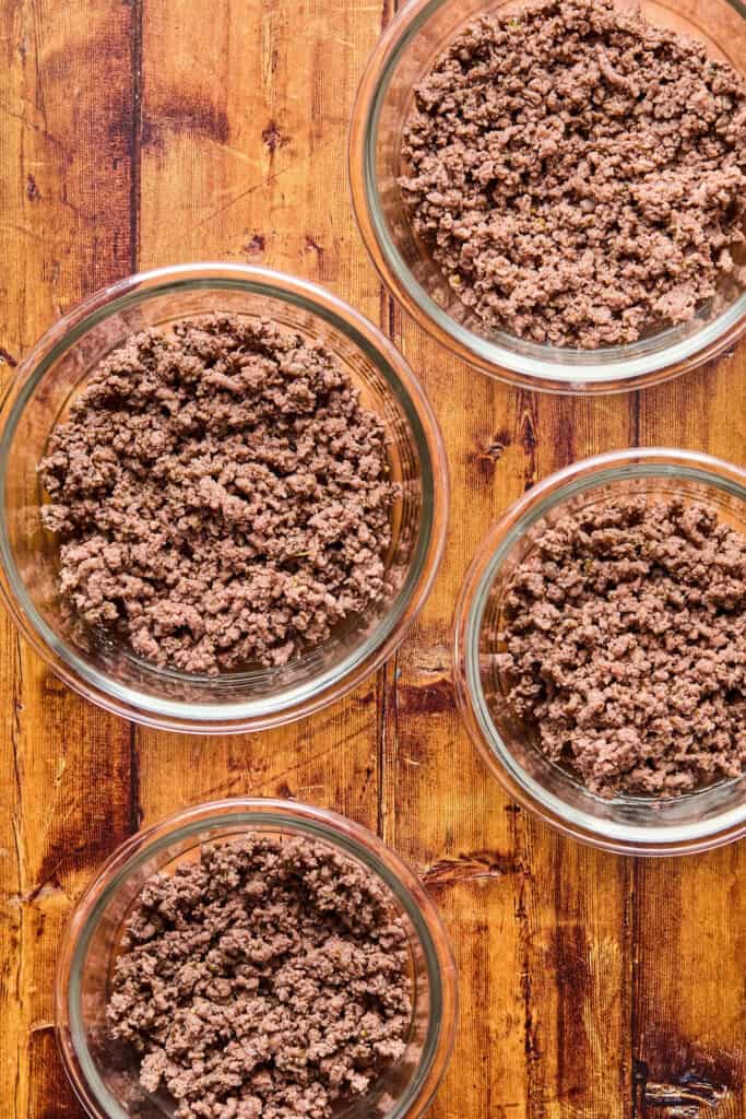 Cooked ground beef in bowls.