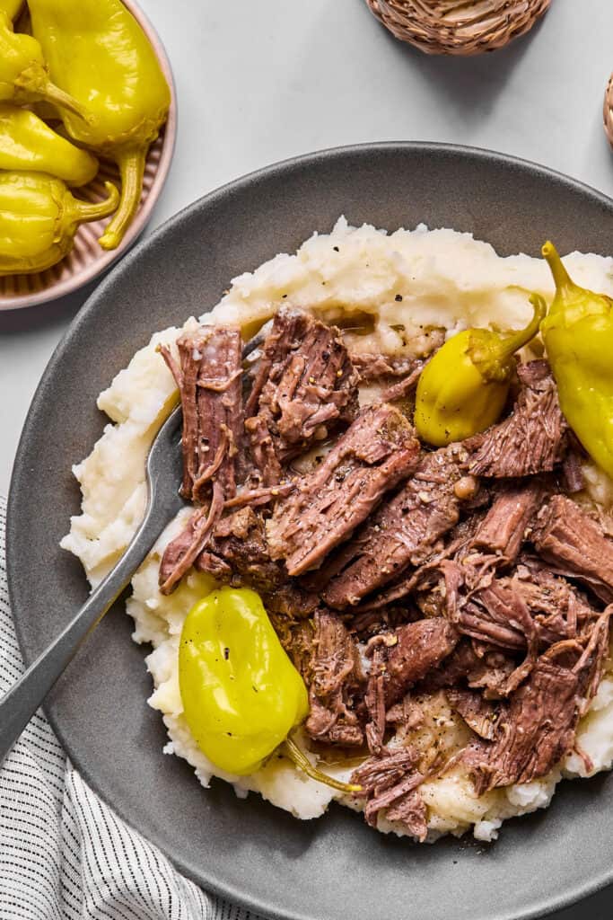 Mississippi Pot Roast with garlic mashed potatoes on a plate.