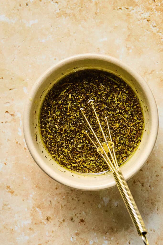 Marinade in a small bowl with a whisk.