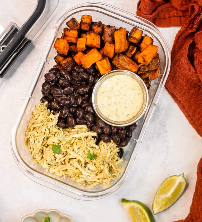 Crockpot Cilantro Lime Chicken Bowls in a meal prep container.