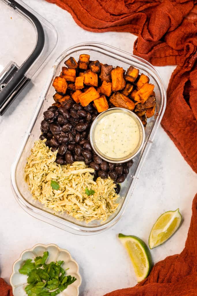 Crockpot Cilantro Lime Chicken Bowls in a meal prep container.