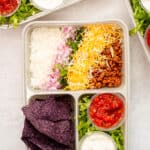 Rainbow Taco Bowls in meal prep containers.