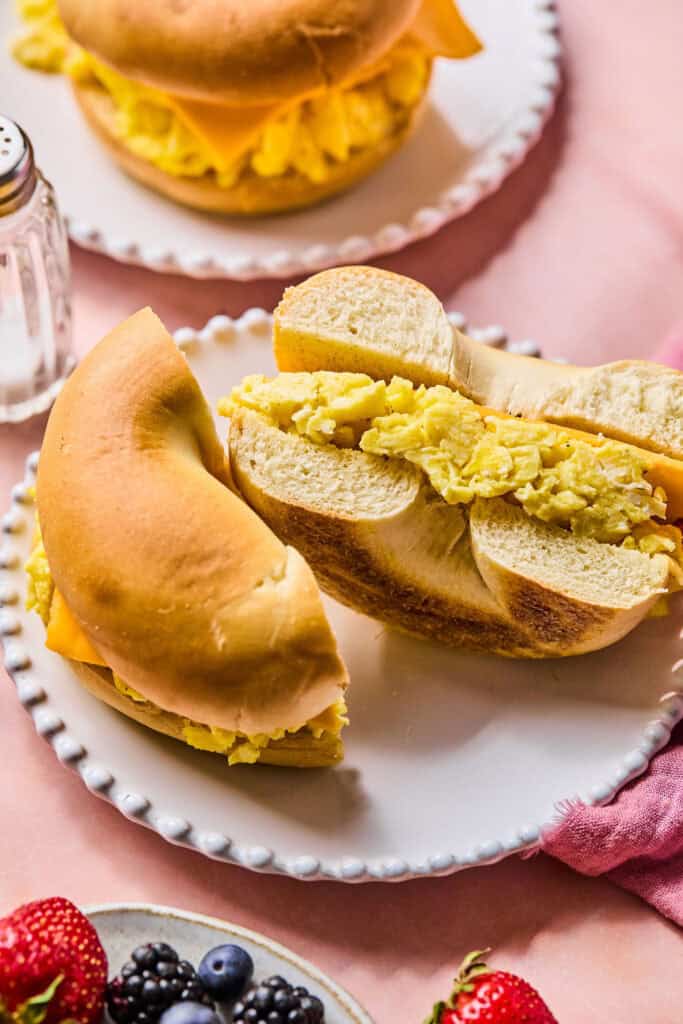 Bagel Breakfast sandwich cut in half on a small plate.