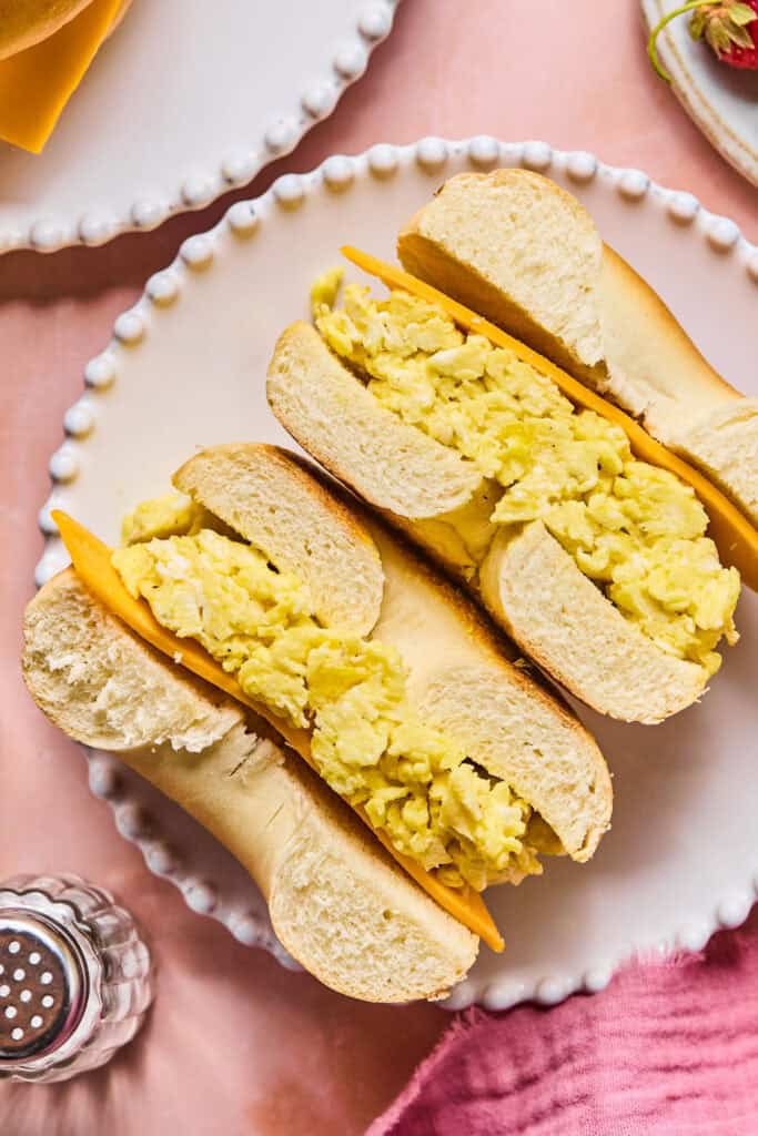 Bagel Breakfast sandwich cut in half on a plate.