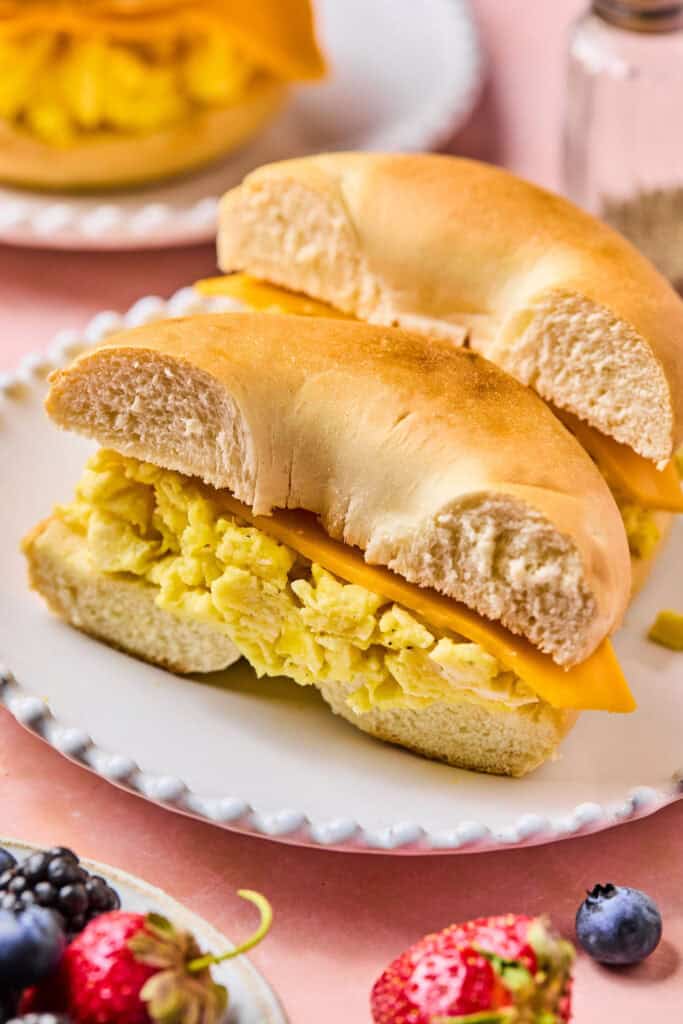 Bagel Breakfast sandwich cut in half on a plate.