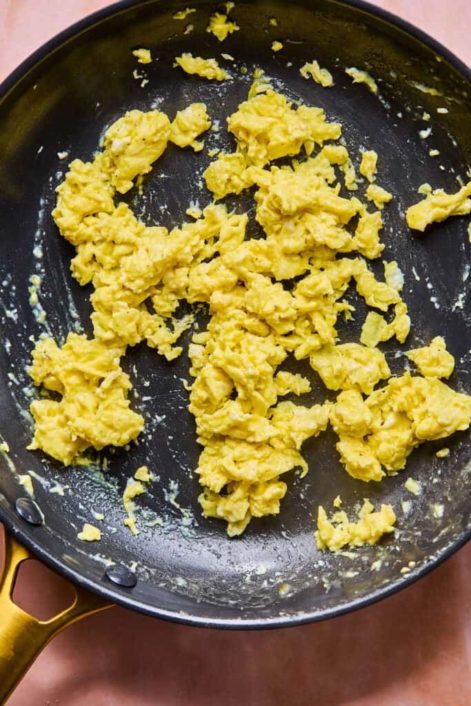 Scrambled eggs in a skillet.